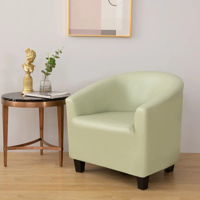 Housse verte en simili cuir sur fauteuil cabriolet