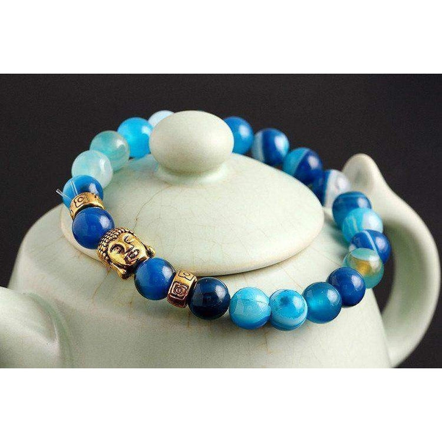 Bracelet avec perles bleues et tête de Bouddha