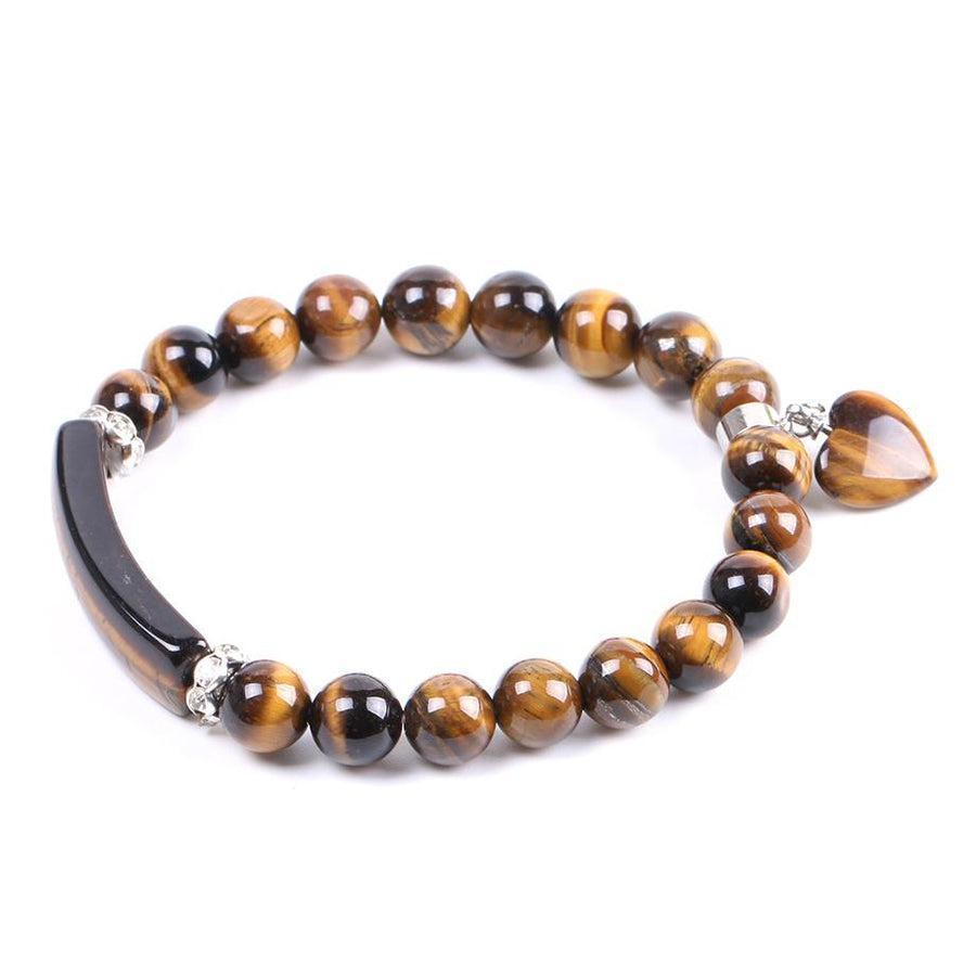 Bracelet Œil de Tigre avec pendentif cœur sur fond neutre