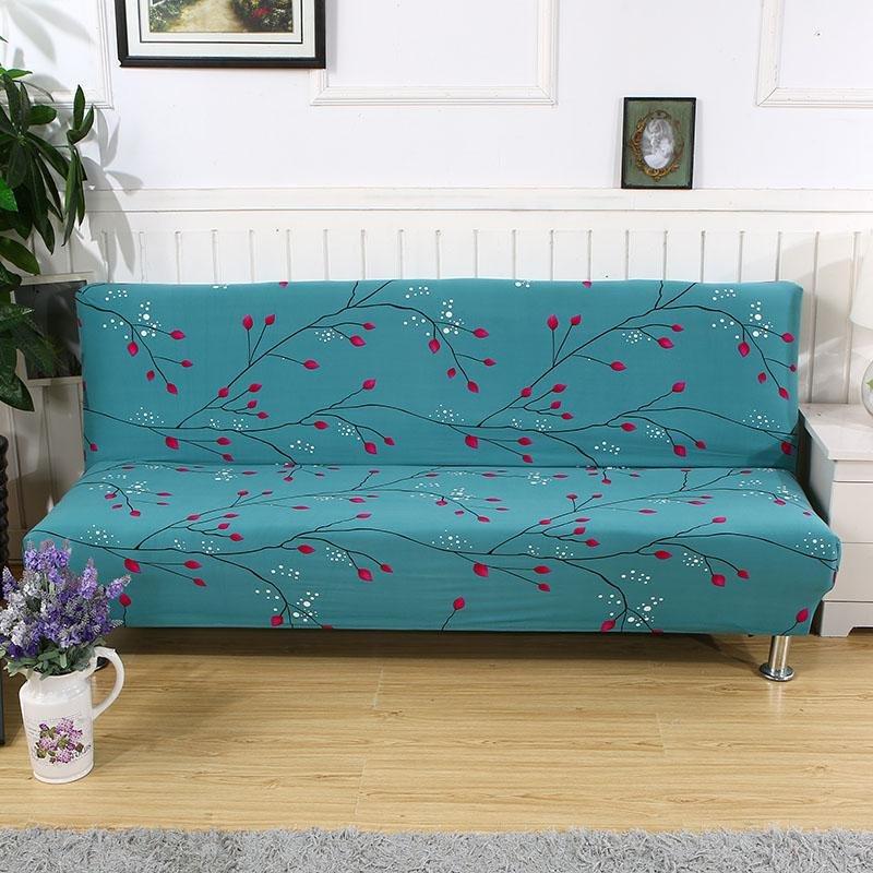 Housse extensible grise sur canapé-lit en mode fermé