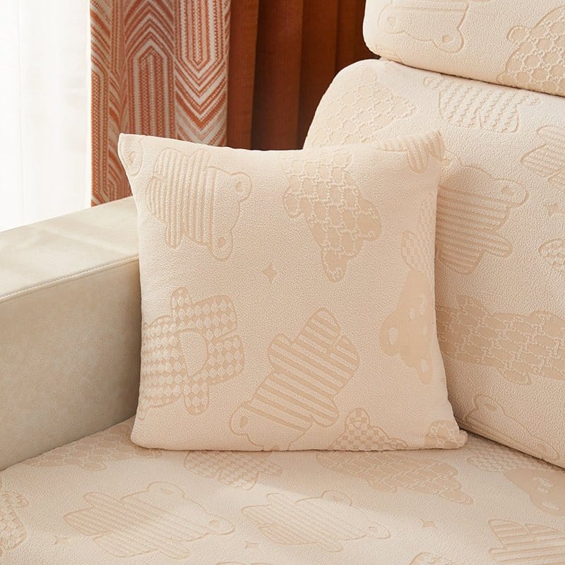 Deux housses de coussin polaire blanc cassé et rose, motif ours