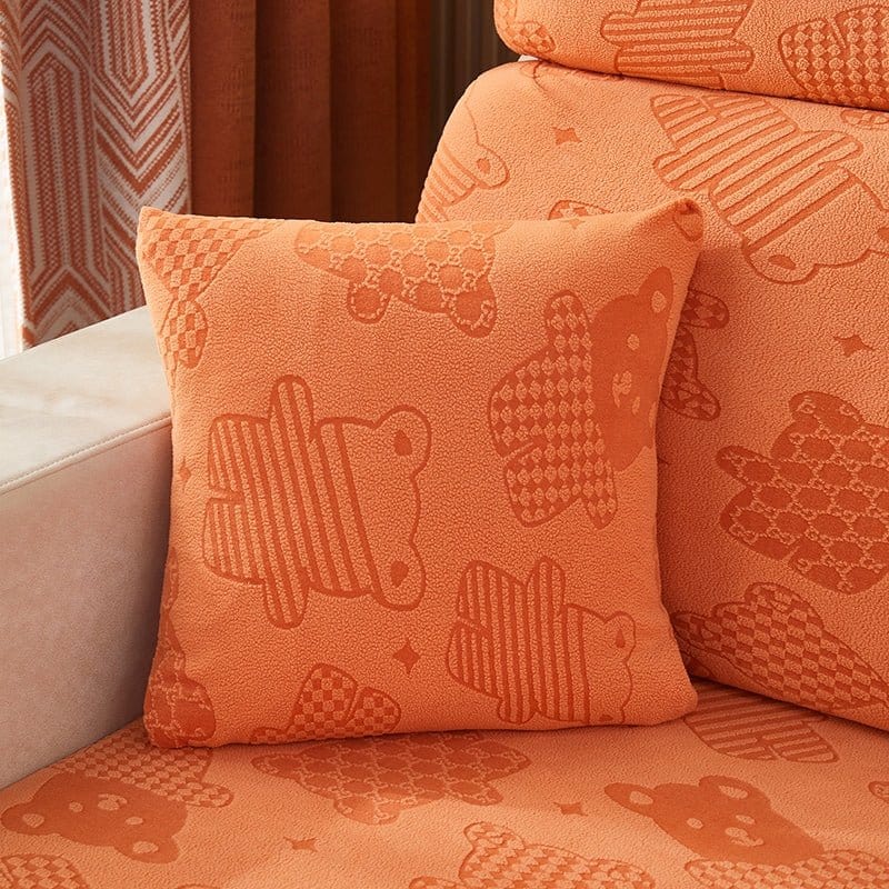 Deux housses de coussin orange en polaire extensible, motif ours