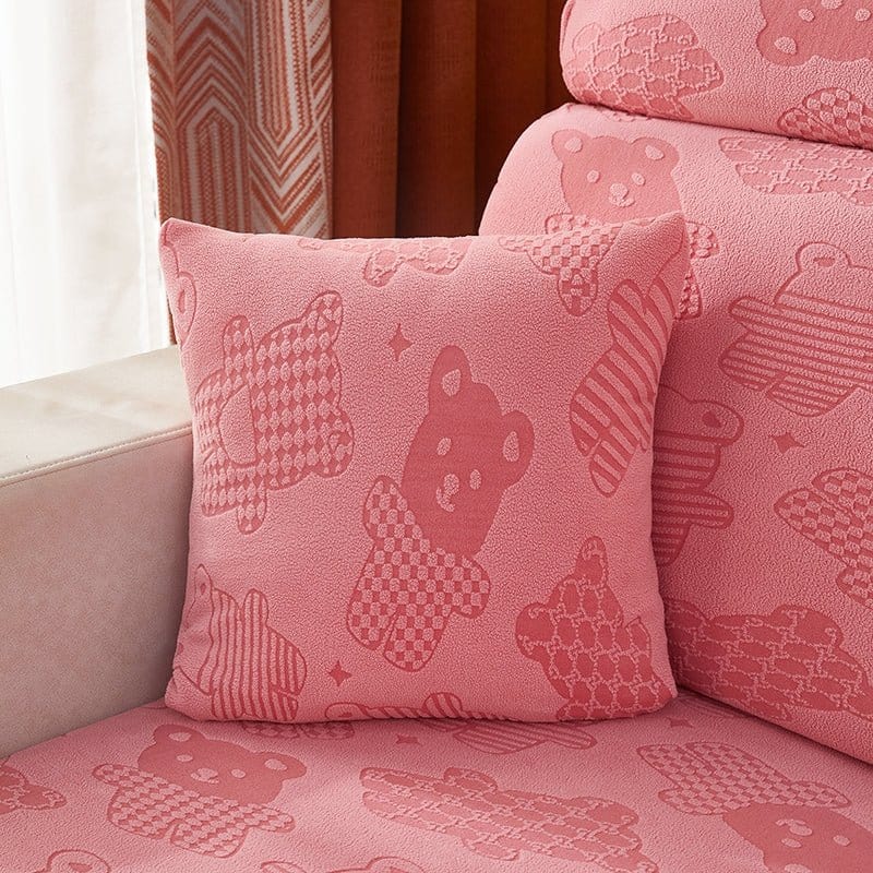Deux housses de coussin roses en polaire extensible, motif ours