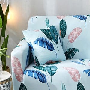 Deux housses de coussin extensibles avec motif feuilles bleues