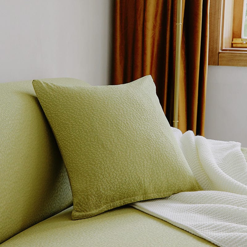 Housse de coussin vert clair imperméable sur canapé