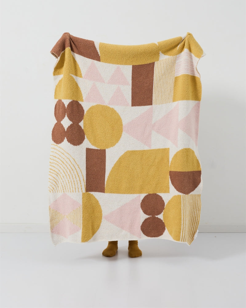 Texture du plaid en sherpa avec motifs roses et jaunes