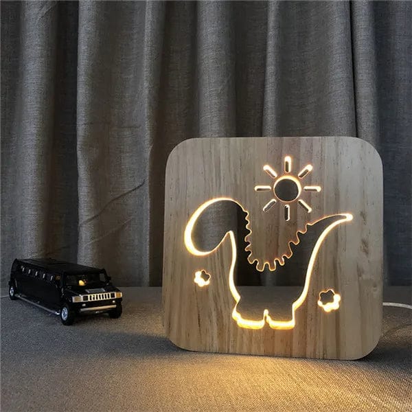 Veilleuse dinosaure LED allumée sur table de chevet