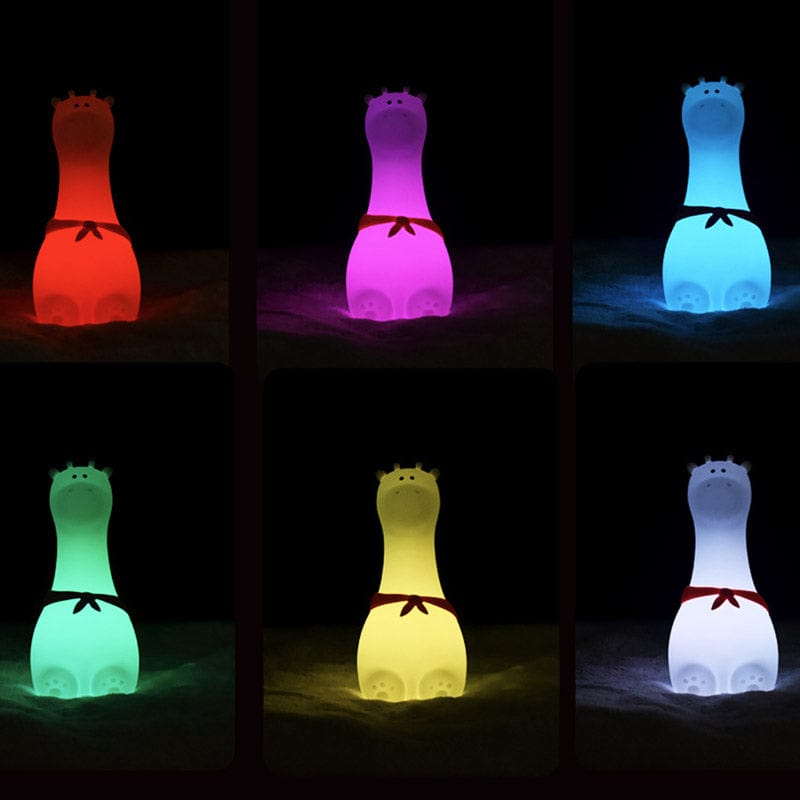 Gros plan sur la veilleuse girafe tactile, texture silicone souple