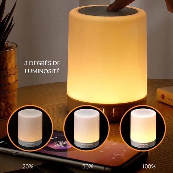 Veilleuse Bluetooth avec lumière LED multicolore sur table de nuit