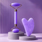Accessoires de massage en quartz rose sur tissu