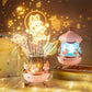 Veilleuse musicale avec projections de lapins roses sur un mur