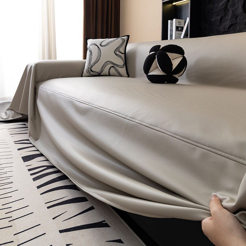 Jeté de canapé marron drapé sur un fauteuil moderne