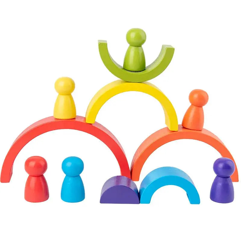 Puzzle en bois pastel formant un arc-en-ciel empilable