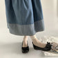 Vue de profil des ballerines montrant le nœud décoratif