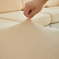 Housse beige sur coussin, vue latérale