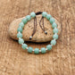 Bracelet en aventurine verte avec perles gravées et nœud coulissant