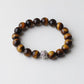 Bracelet extensible avec perles marron et dorées