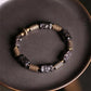 Bracelet artisanal en bois d'ébène et cuivre martelé