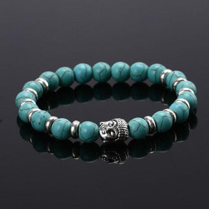 Vue rapprochée du bracelet en pierres marbrées et Bouddha