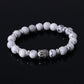 Bracelet zen avec pierres noires et Bouddha argenté