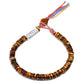 Bracelet en Œil de tigre avec symbole Om gravé