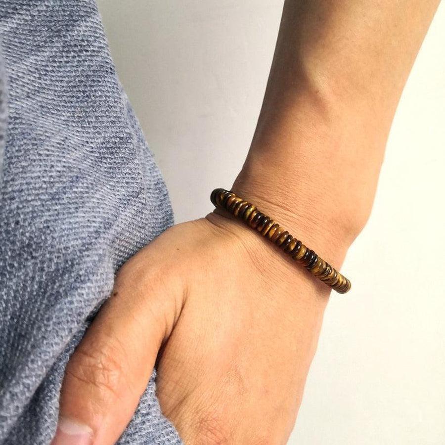 Bracelet artisanal avec perle cylindrique Om sur coton coloré