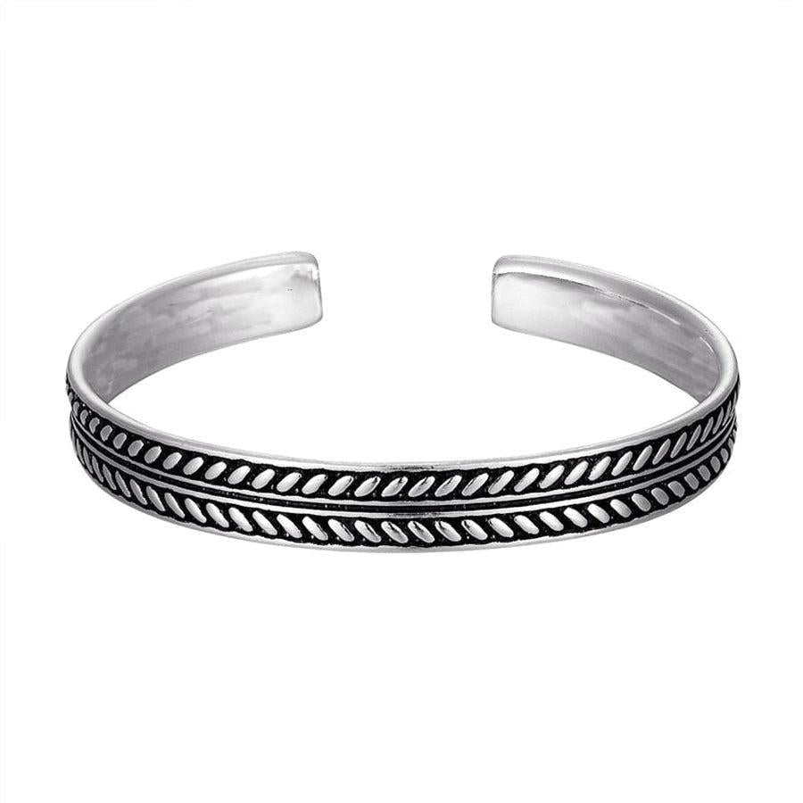 Bracelet jonc argenté unisexe sur fond blanc, vue de côté