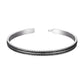 Vue de dessus d'un bracelet jonc argenté large et élégant