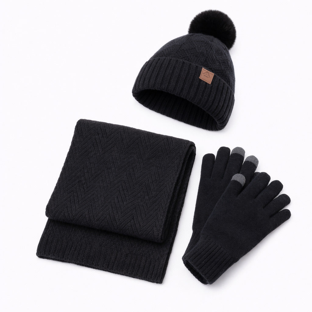 Écharpe et gants assortis posés sur une surface en bois