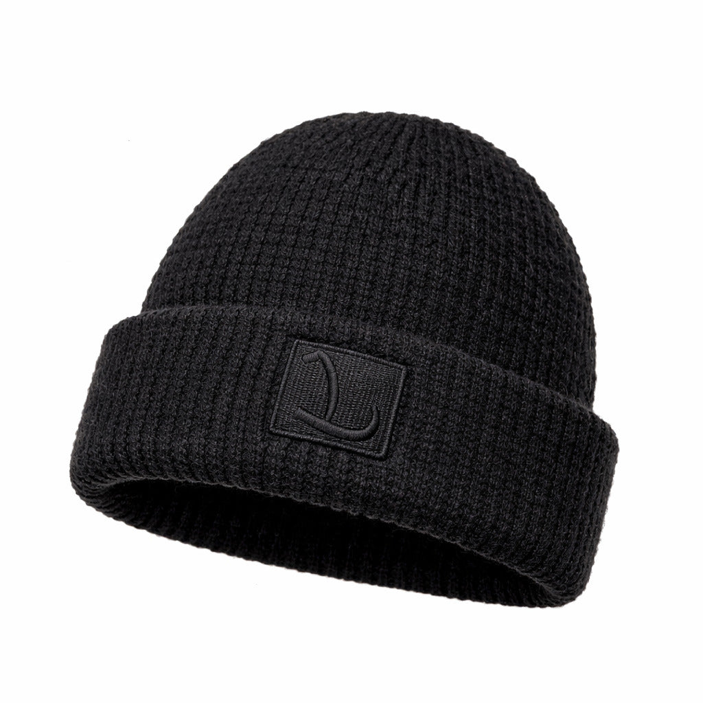 Vue rapprochée du bonnet en laine torsadée