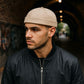 Bonnet docker noir avec boucle métallique réglable
