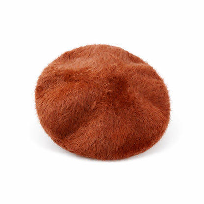 Béret en fourrure camel avec lumière naturelle