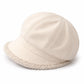 Vue de dessus d'un béret féminin léger, couleur neutre
