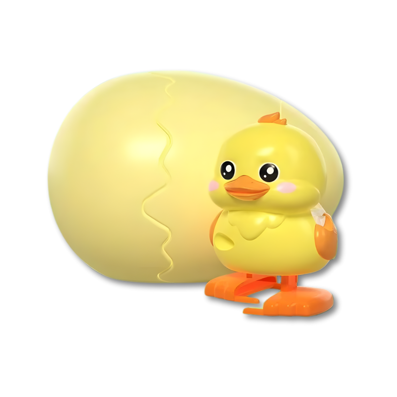 Petit poussin jaune bondissant hors de l'œuf surprise