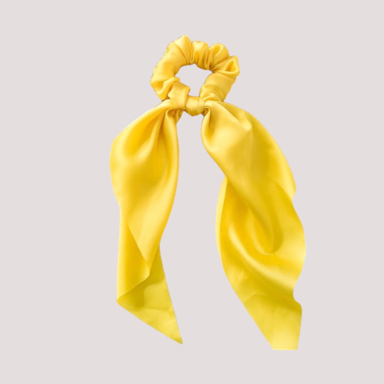 Chouchou foulard jaune sur fond blanc, textile léger