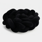 Vue rapprochée d'une tresse de lit noire, texture velours
