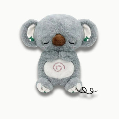 Petite fille endormie avec veilleuse koala apaisante