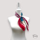 Foulard carré floral avec bordure rouge et motifs colorés