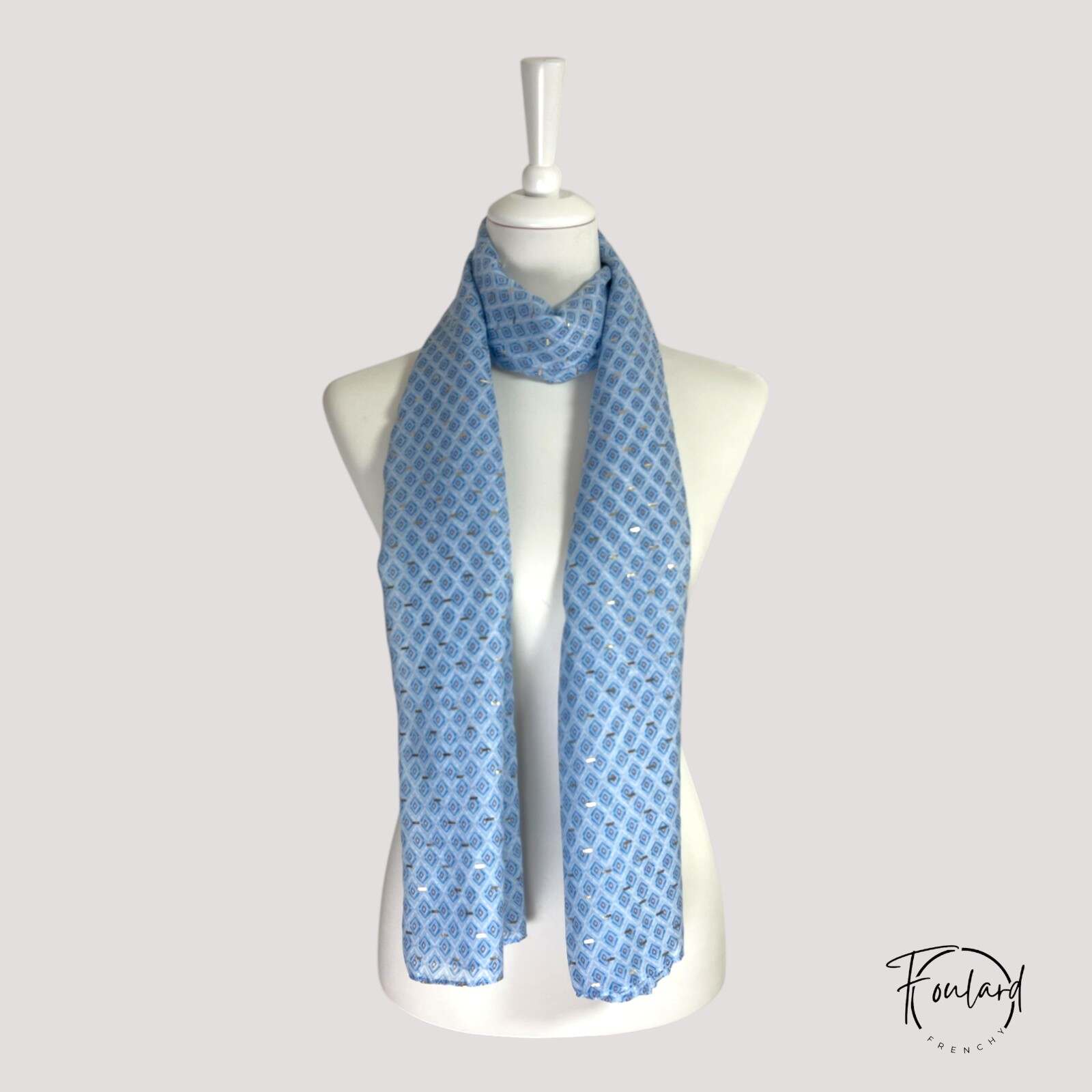 Foulard bleu avec motifs géométriques dorés scintillants
