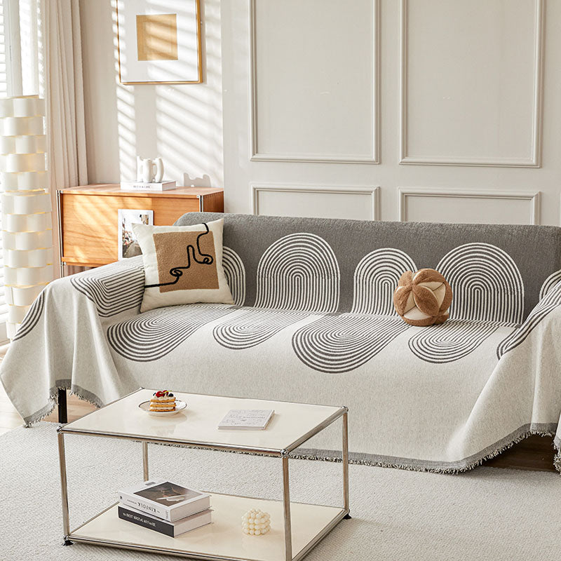Jeté de canapé gris en coton naturel sur un fauteuil