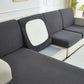 Vue latérale d'une housse de coussin grise, texture détaillée