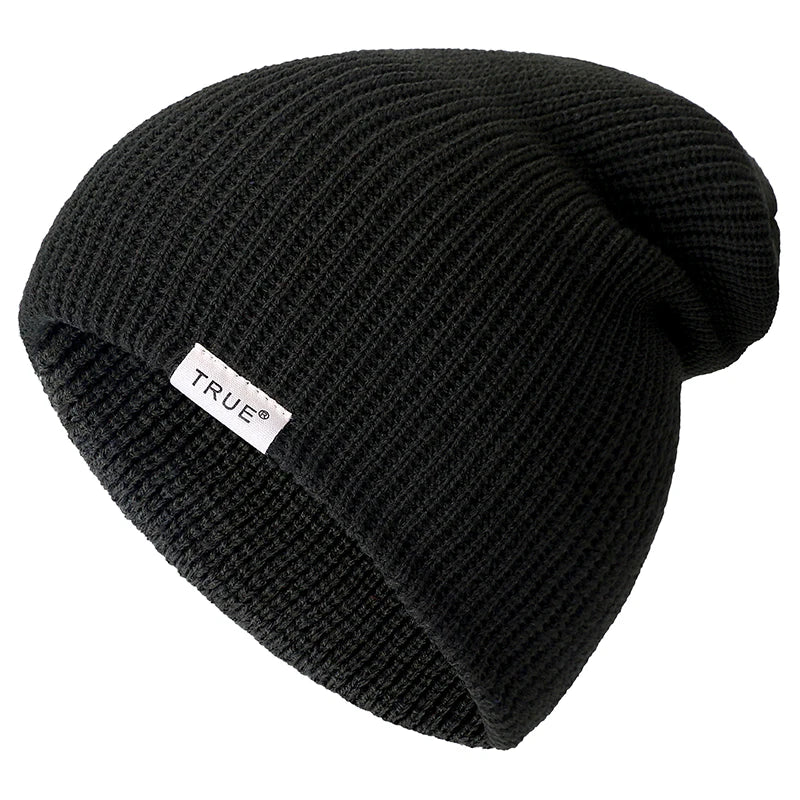 Vue de profil d'un bonnet vert foncé en maille