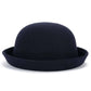 Chapeau melon en feutre, avec une étiquette de taille visible à l'intérieur