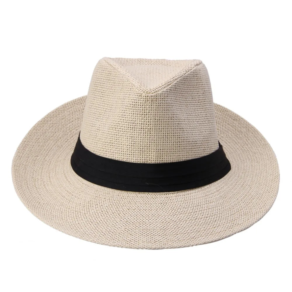 Chapeau de paille suspendu à un crochet, mur en arrière-plan