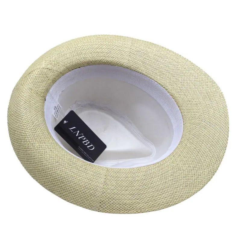 Chapeau de paille avec large bord, posé sur une couverture