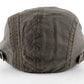 Détail des surpiqûres sur un béret en toile