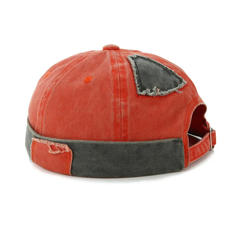 Bonnet Docker avec motifs patchwork et finition usée