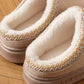 Pantoufles posées sur un tapis, ambiance cocooning