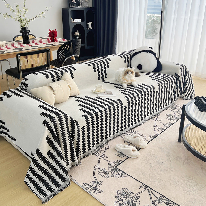 Vue d'ensemble du jeté de canapé sur un mobilier moderne