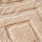 Jeté marron couvrant un canapé d'angle, ambiance cocooning